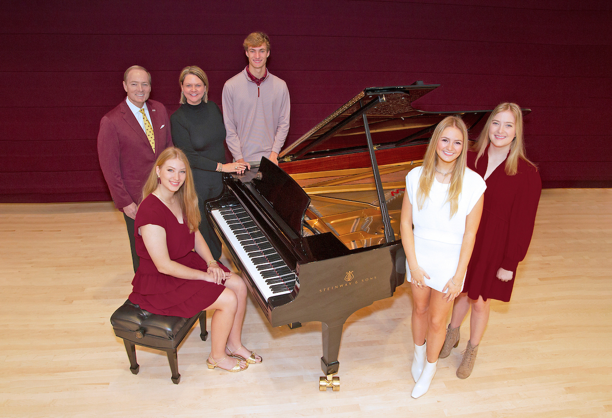 family picture by piano