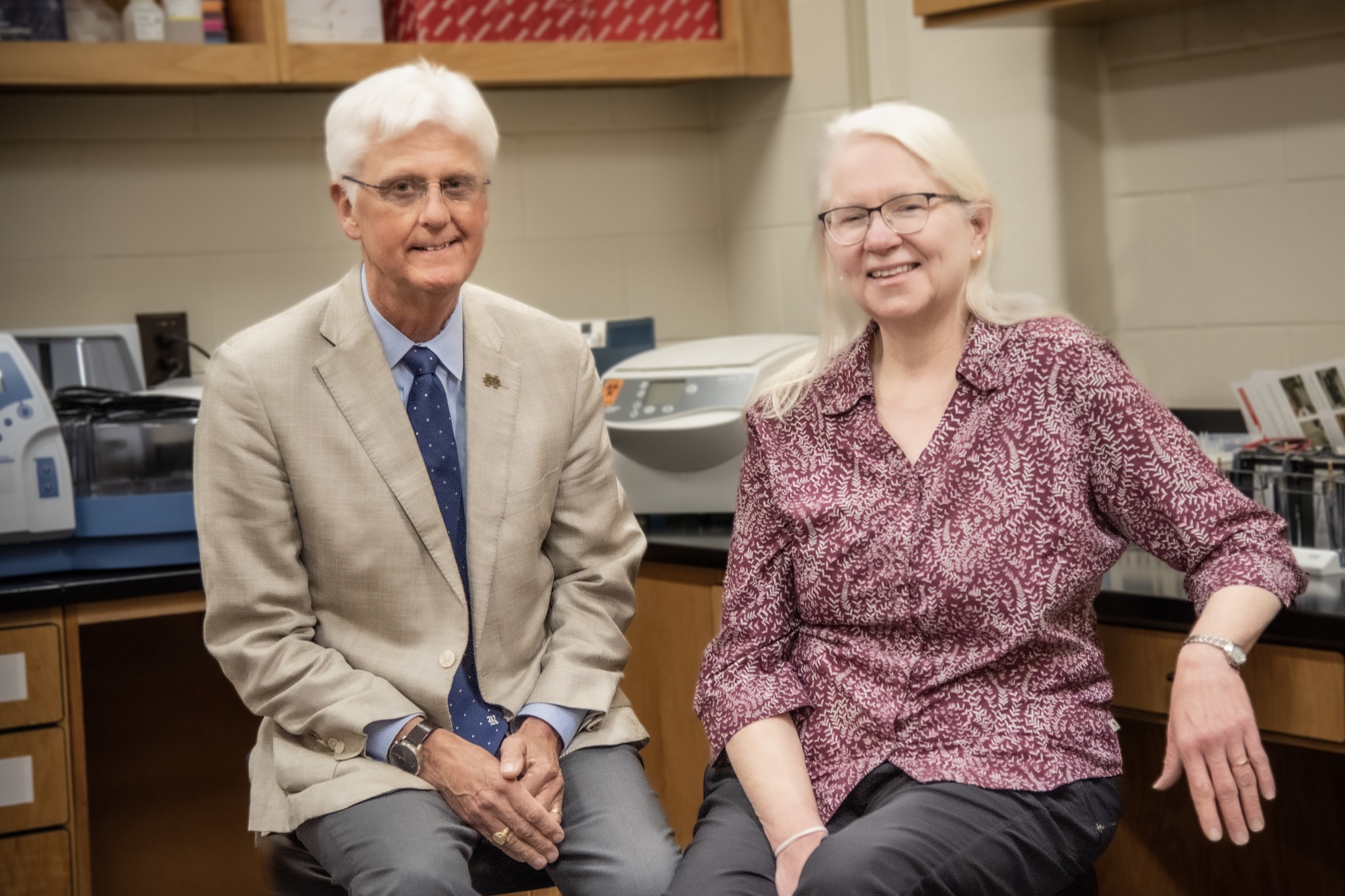 two scientists sitting in a lab 