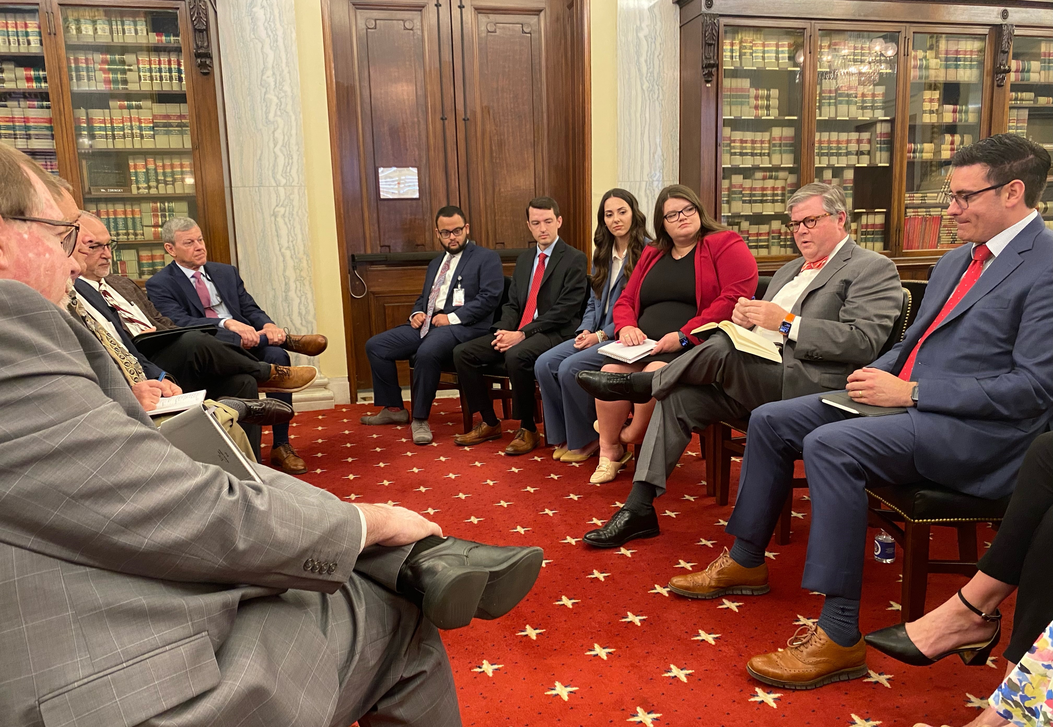 people sitting down talking