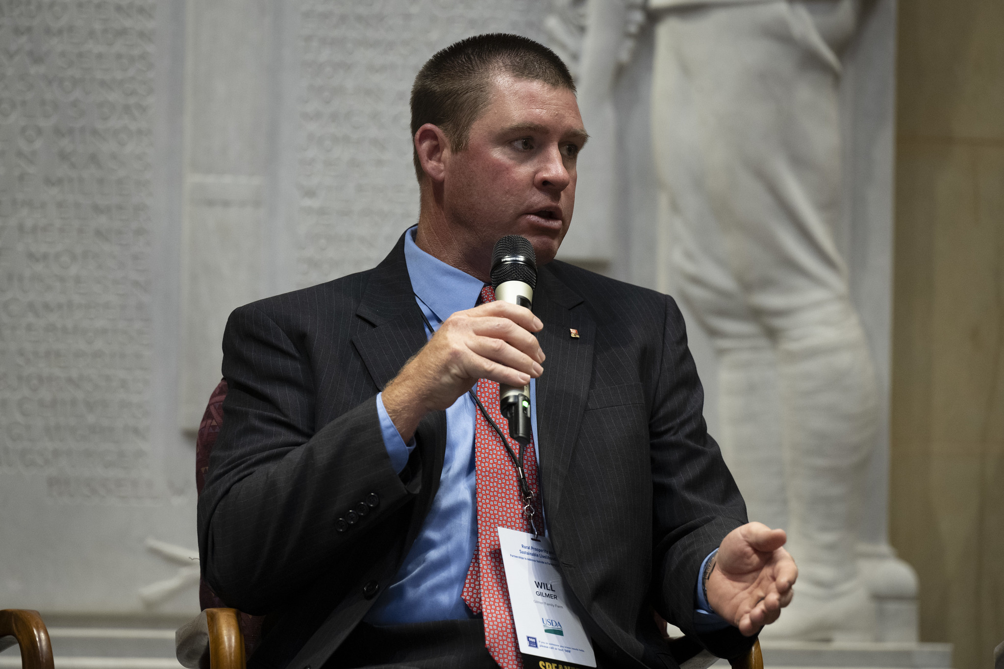 Will Gilmer speaks during a panel discussion about stress on the farm. 