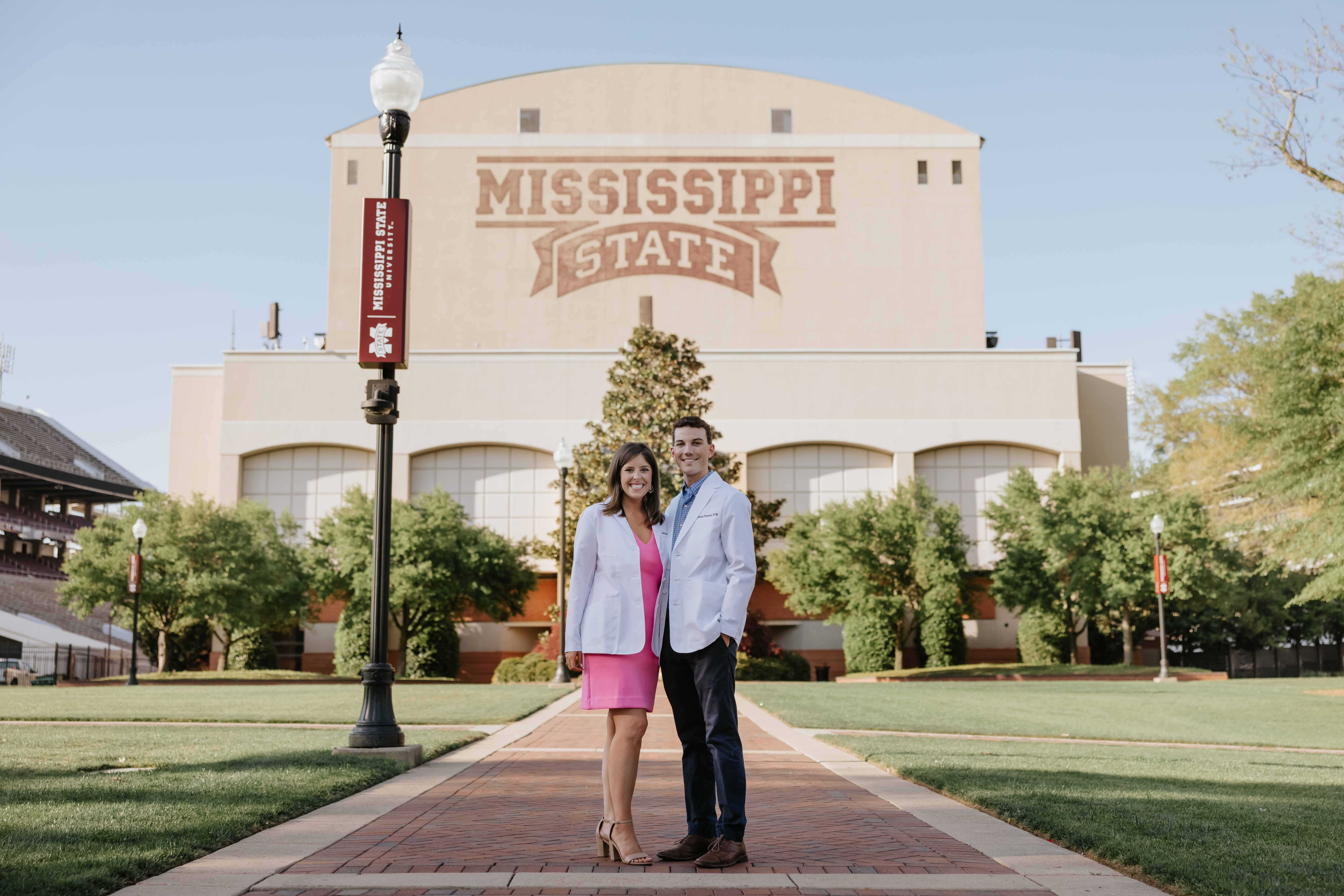 man and woman standing in the junction at MSU wearing white lab coats