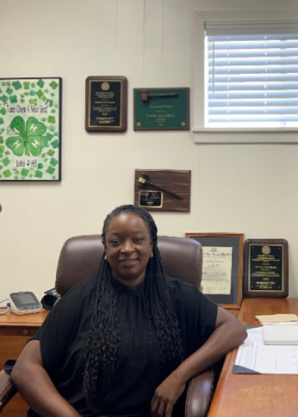 Woman sitting at desk smiling