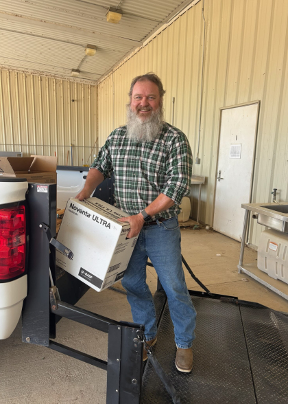 Monroe Walker unloading a box from a truck